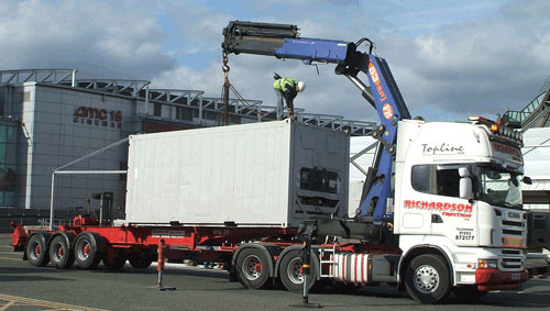 Hiab crane truck lifting container at AMC